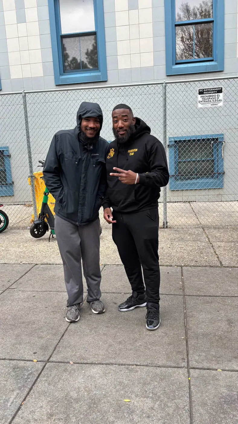 Foundation team member smiling with a young Washington DC resident